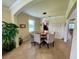 Bright dining area with modern lighting, comfortable seating, and views of the kitchen and game room at 20940 Valore Ct, Venice, FL 34293