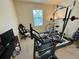 Home exercise room with fitness equipment, offering a private space for workouts at 20940 Valore Ct, Venice, FL 34293