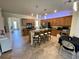 Updated kitchen with a large island, breakfast bar, and ample storage space, perfect for entertaining guests at 20940 Valore Ct, Venice, FL 34293