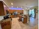 Spacious kitchen features granite countertops, stainless steel appliances, and a convenient breakfast bar at 20940 Valore Ct, Venice, FL 34293