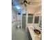 Bathroom features a modern vanity with dual sinks and white cabinets, plus a tiled shower at 2200 E Village Ct, Venice, FL 34293