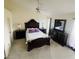 Main bedroom featuring decorative furnishings, ceiling fan, and natural lighting at 2200 E Village Ct, Venice, FL 34293