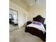 Main bedroom featuring decorative furnishings, ceiling fan, and view of mirrored closet doors at 2200 E Village Ct, Venice, FL 34293