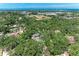 Expansive community with mature trees, landscaping, and manicured lawns near the water at 2237 Circlewood Dr # 18, Sarasota, FL 34231