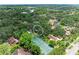 Aerial view highlighting property location within a verdant neighborhood, circle indicates property location at 2237 Circlewood Dr # 18, Sarasota, FL 34231
