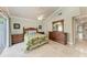 Bright bedroom with palm-themed bedding, wood furniture, and tile flooring at 2237 Circlewood Dr # 18, Sarasota, FL 34231