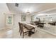 Traditional dining room featuring a dark wood table and chairs with beige tiled floors at 2237 Circlewood Dr # 18, Sarasota, FL 34231