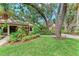 Beautiful home surrounded by mature landscaping, vibrant green grass, and charming curb appeal at 2237 Circlewood Dr # 18, Sarasota, FL 34231