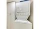Stackable washer and dryer with adjacent storage cabinets, providing convenient laundry solutions at 2237 Circlewood Dr # 18, Sarasota, FL 34231