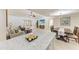 Inviting living space showcasing tile flooring, comfortable furnishings, and a dining area with a stylish table setting at 2237 Circlewood Dr # 18, Sarasota, FL 34231