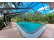 Large screened-in pool with plenty of room for swimming and lounging in a private backyard setting at 2237 Circlewood Dr # 18, Sarasota, FL 34231