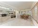 Sunroom with dining area and view of adjacent spaces at 2237 Circlewood Dr # 18, Sarasota, FL 34231