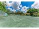 Enjoy a match on this community tennis court, complete with manicured grounds and beautiful blue sky at 2237 Circlewood Dr # 18, Sarasota, FL 34231