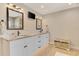 Bathroom featuring dual vanities with granite countertops, white cabinets, and tile flooring at 227 Monet Dr, Nokomis, FL 34275