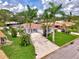 An elevated view of a cozy home and a wide driveway at 227 Monet Dr, Nokomis, FL 34275