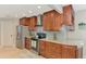 Updated kitchen features stainless steel appliances, granite countertops, and plenty of cabinet space at 227 Monet Dr, Nokomis, FL 34275