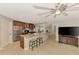 Spacious kitchen with stainless steel appliances, large island, open floor plan, and bar stool seating at 227 Monet Dr, Nokomis, FL 34275