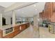 Bright, open-concept kitchen with stainless appliances, granite countertops, and convenient breakfast bar at 227 Monet Dr, Nokomis, FL 34275
