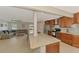 Open-concept kitchen with a large island, stainless steel appliances, and view to the living room at 227 Monet Dr, Nokomis, FL 34275