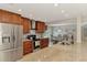 Well-equipped kitchen with stainless steel appliances, granite countertops, and a view of the dining area at 227 Monet Dr, Nokomis, FL 34275