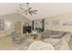 Bright living room featuring vaulted ceilings, a cozy fireplace, and comfortable seating at 227 Monet Dr, Nokomis, FL 34275