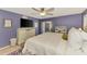 Serene main bedroom with a slider to the lanai, a ceiling fan, and an en suite bathroom at 227 Monet Dr, Nokomis, FL 34275