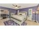 Inviting main bedroom boasts natural light, an en suite bathroom, a ceiling fan, and slider to the lanai at 227 Monet Dr, Nokomis, FL 34275