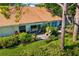 Aerial view of home with a private backyard featuring a stone patio and lush landscaping at 2411 New Haven Cir # 70, Sun City Center, FL 33573