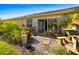 Beautifully landscaped backyard with a stone patio and easy access to the home at 2411 New Haven Cir # 70, Sun City Center, FL 33573