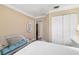 Spacious bedroom featuring large closet space, hardwood floors, and bright, natural light at 2411 New Haven Cir # 70, Sun City Center, FL 33573