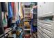 Well-organized walk-in closet with shelves, rods, and drawers for ample storage space at 2411 New Haven Cir # 70, Sun City Center, FL 33573