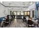 Spacious dining area with elegant chairs and decorative pendant lights at 2411 New Haven Cir # 70, Sun City Center, FL 33573