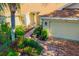 Inviting single-story home boasting a brick pathway and meticulously landscaped yard at 2411 New Haven Cir # 70, Sun City Center, FL 33573