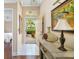 Bright and airy foyer with tile flooring and views of the landscaped front yard at 2411 New Haven Cir # 70, Sun City Center, FL 33573