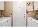 Functional laundry room equipped with white washer and dryer units at 2411 New Haven Cir # 70, Sun City Center, FL 33573