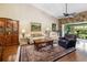 Cozy living room with hardwood floors, stone fireplace, and comfortable seating arrangement at 2411 New Haven Cir # 70, Sun City Center, FL 33573