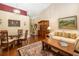 Inviting living room and dining area with hardwood floors, perfect for entertaining guests at 2411 New Haven Cir # 70, Sun City Center, FL 33573