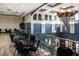 Upper level lounge area with tables and chairs at 2411 New Haven Cir # 70, Sun City Center, FL 33573