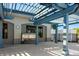 Outdoor grill with a pergola offering shade and a great space for summer barbeques at 2411 New Haven Cir # 70, Sun City Center, FL 33573