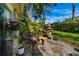 Picturesque stone patio with lush plantings offering a private outdoor retreat at 2411 New Haven Cir # 70, Sun City Center, FL 33573