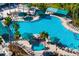 The community offers a large outdoor swimming pool with a hot tub, plenty of seating, and shade from umbrellas and palm trees at 2411 New Haven Cir # 70, Sun City Center, FL 33573
