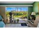 Relaxing sunroom that opens to a beautiful patio surrounded by lush greenery at 2411 New Haven Cir # 70, Sun City Center, FL 33573