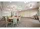 Versatile meeting room with tables, chairs, and neutral decor perfect for gatherings at 25143 Spartina Dr, Venice, FL 34293