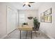 Home office with hard surface floors, a ceiling fan, and natural light at 25143 Spartina Dr, Venice, FL 34293