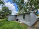 View of backyard featuring a gray home at 27 Tucker Ave, Sarasota, FL 34232