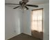 Bedroom showcasing neutral paint, standard ceiling fan, and natural lighting at 27 Tucker Ave, Sarasota, FL 34232