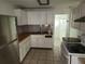 Bright kitchen featuring stainless steel refrigerator and stove and butcher block countertops at 27 Tucker Ave, Sarasota, FL 34232