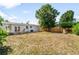 Large backyard with wood deck and partial view of house at 2802 21St W St, Bradenton, FL 34205