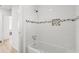 Bright bathroom featuring a bathtub with white subway tile and decorative mosaic accents at 2802 21St W St, Bradenton, FL 34205