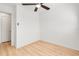 Minimalist bedroom with light wood floors and ceiling fan at 2802 21St W St, Bradenton, FL 34205